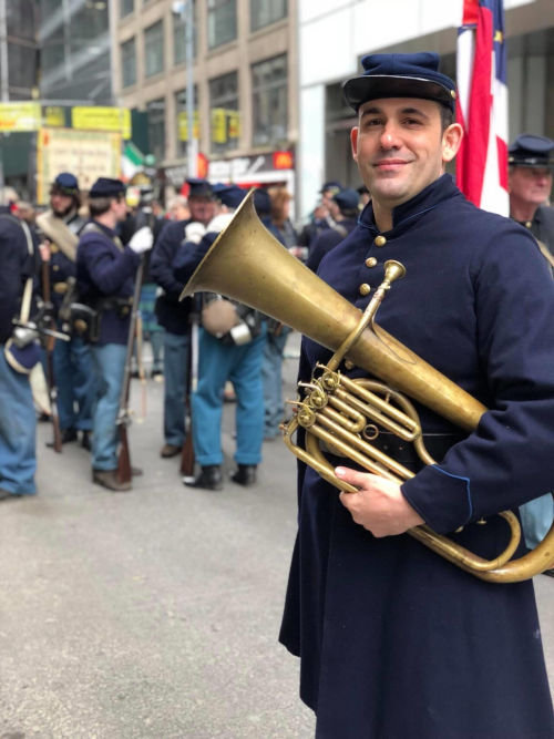 in civil war habit playing saxhorn for St. Patrick's Day in New York City